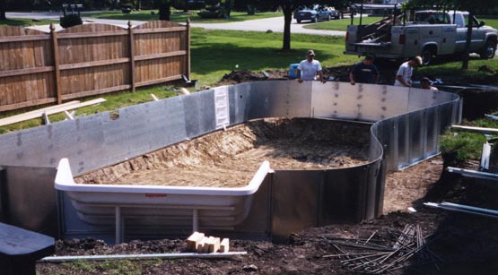 Steel wall panels being assembled for the pool structure